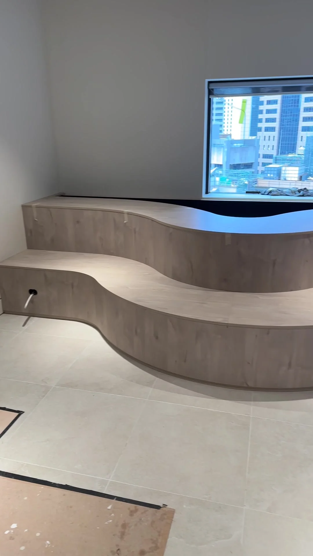 Detail of curved custom joinery reception bench, Potts Point commercial fitout