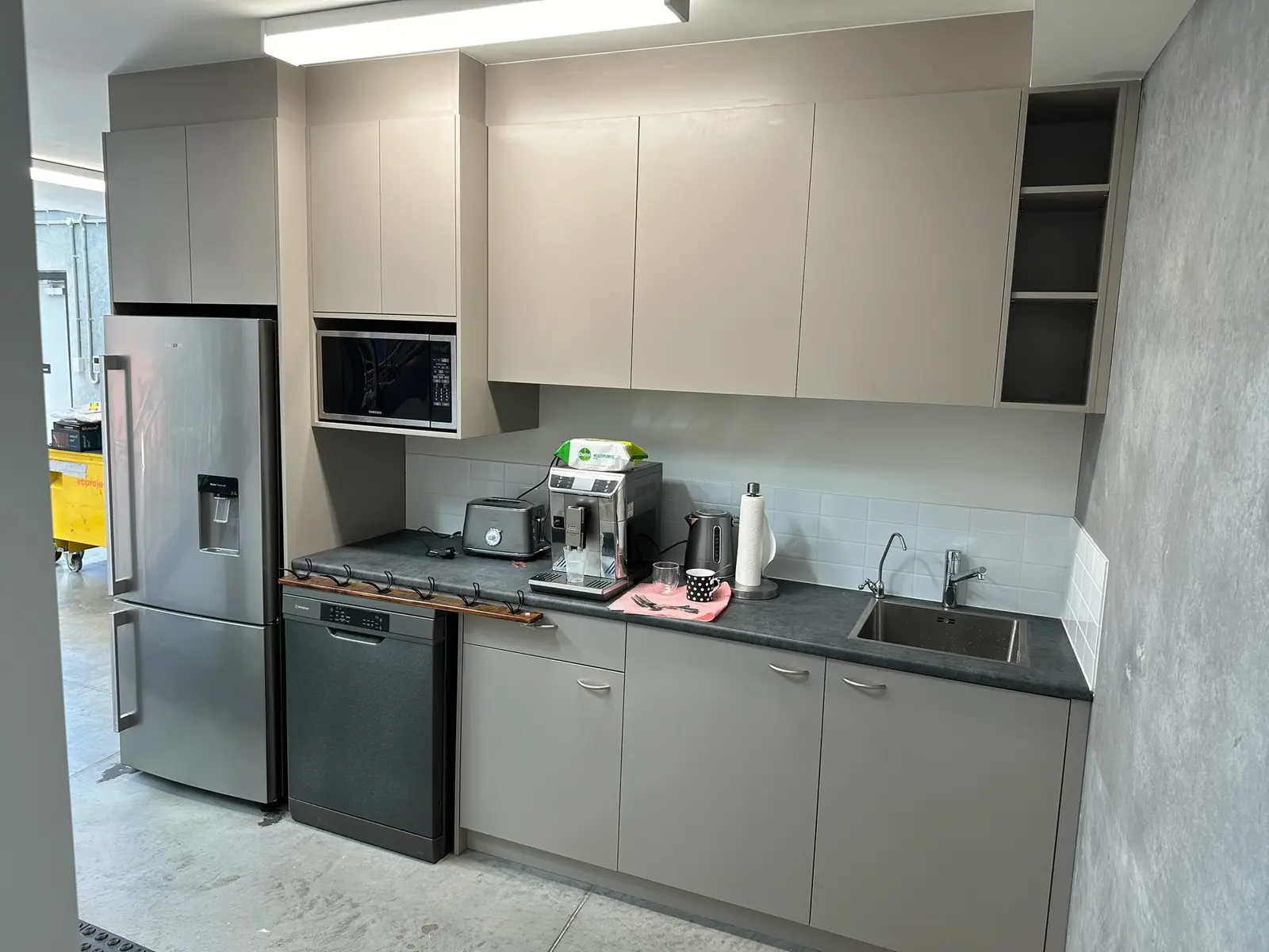 Commercial kitchenette with integrated fridge, dishwasher and coffee machine in Mosman, NSW by FRANCA FITOUTS