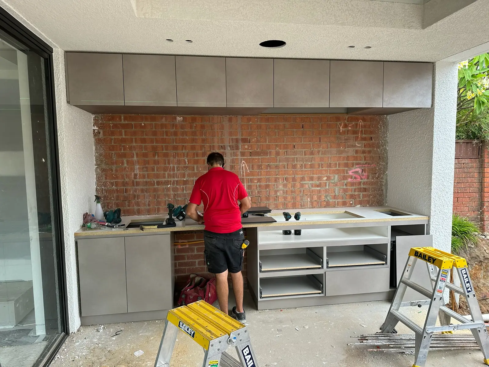Outdoor kitchen cabinetry with benchtop cut-outs for a sink and cooktop, Sutherland Shire