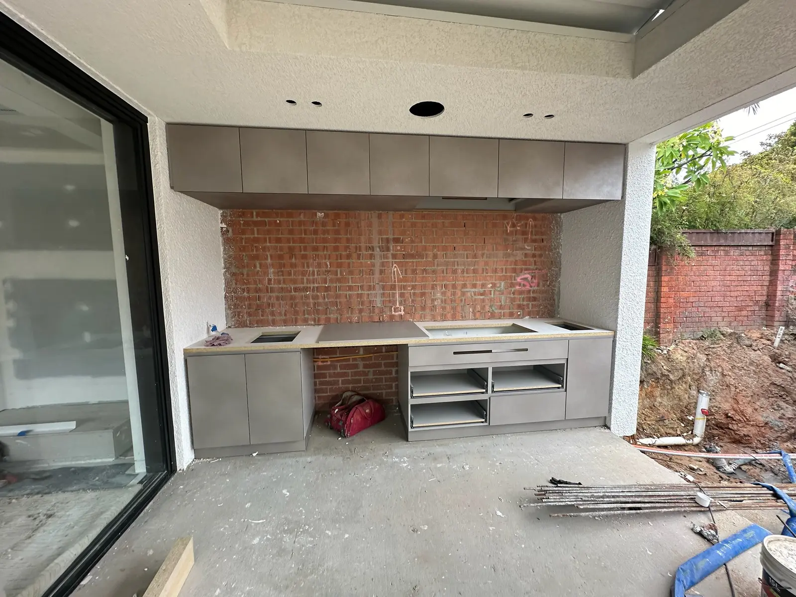 Custom outdoor kitchen cabinetry installed against an exposed brick wall, Sutherland Shire alfresco kitchen by FRANCA FITOUTS