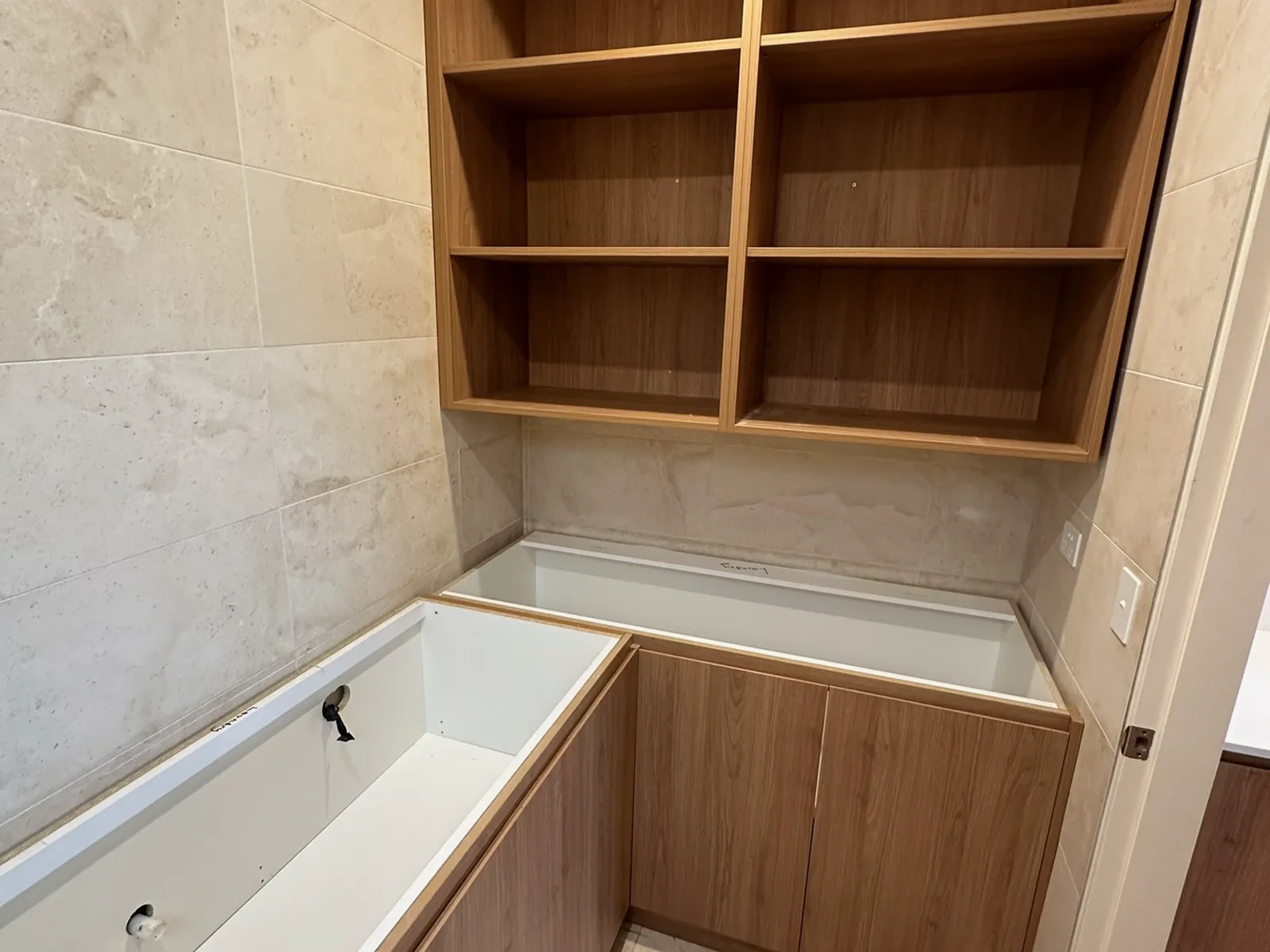 Open timber shelving and built-in bench in the laundry and pantry, Bondi Junction renovation