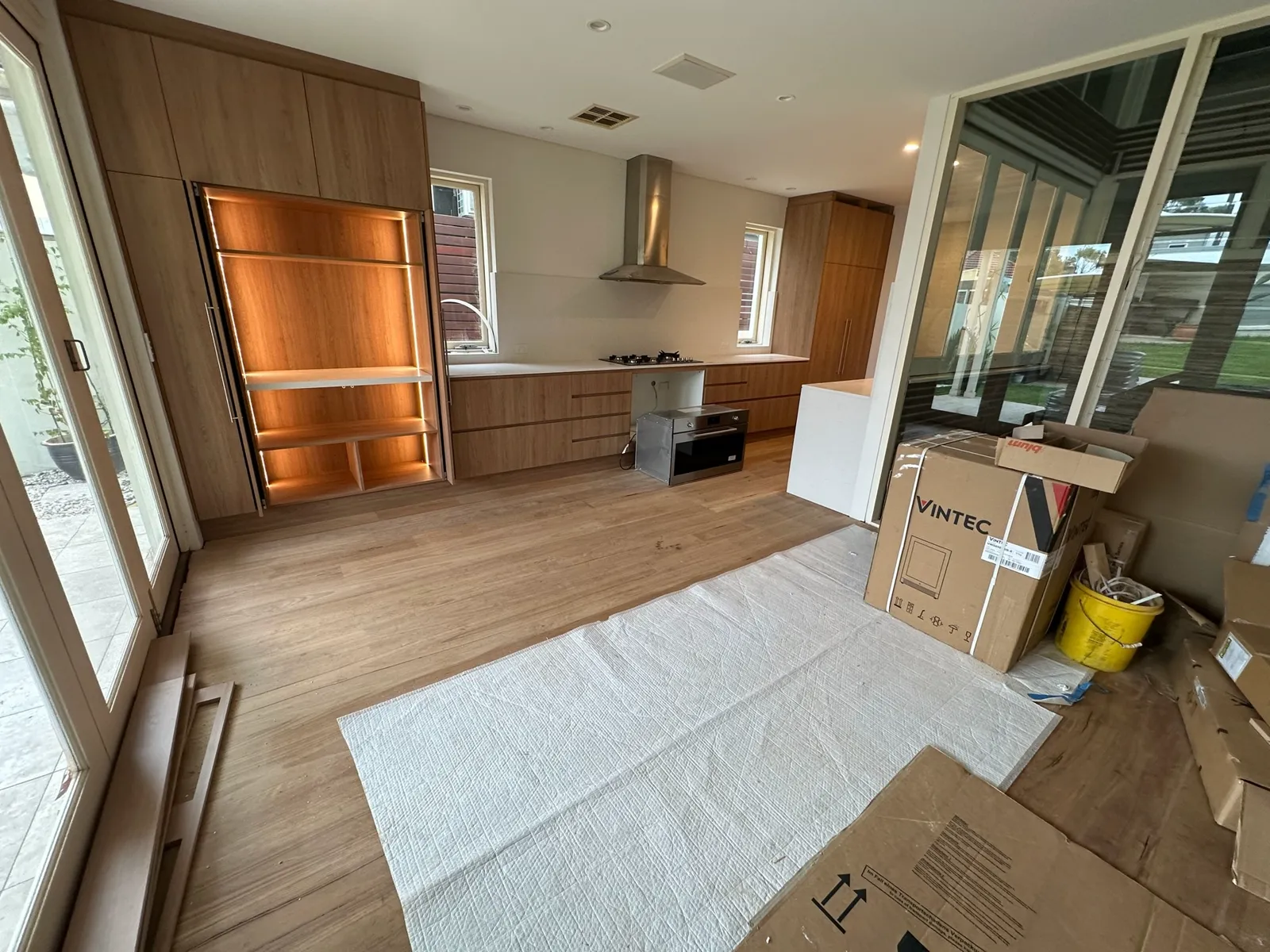 Kitchen renovation with full-height integrated fridge cabinetry and internal lighting, Bondi Junction