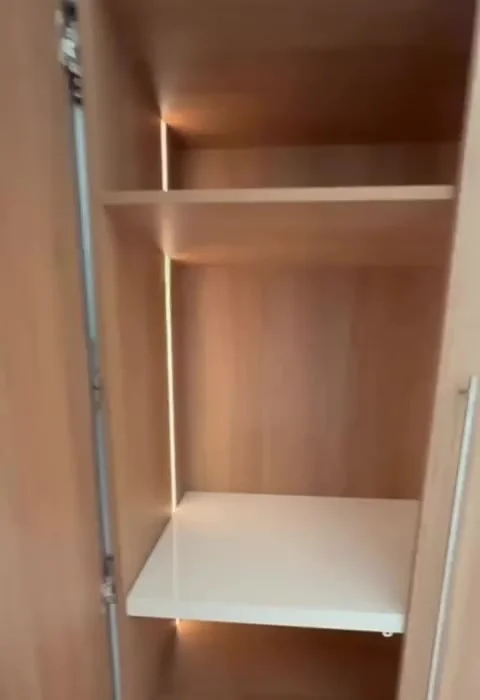 Built-in wardrobe interior with integrated lighting and shelving, Coogee custom joinery
