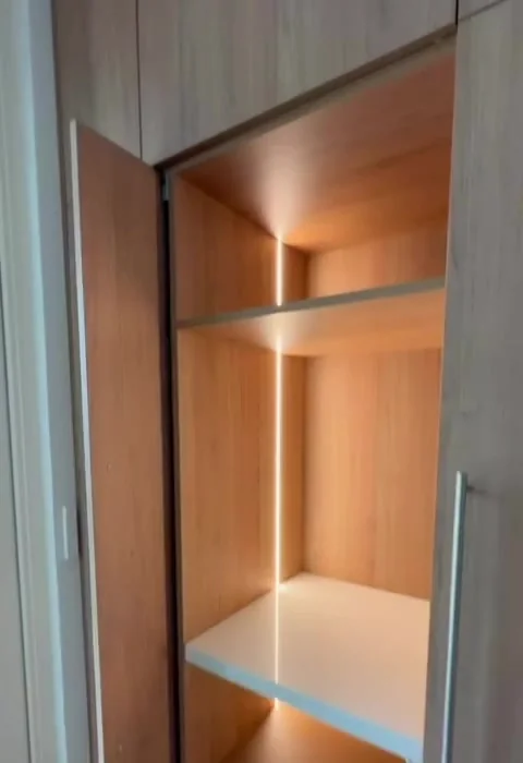 Custom built-in wardrobe with integrated LED shelf lighting, Coogee joinery project by FRANCA FITOUTS